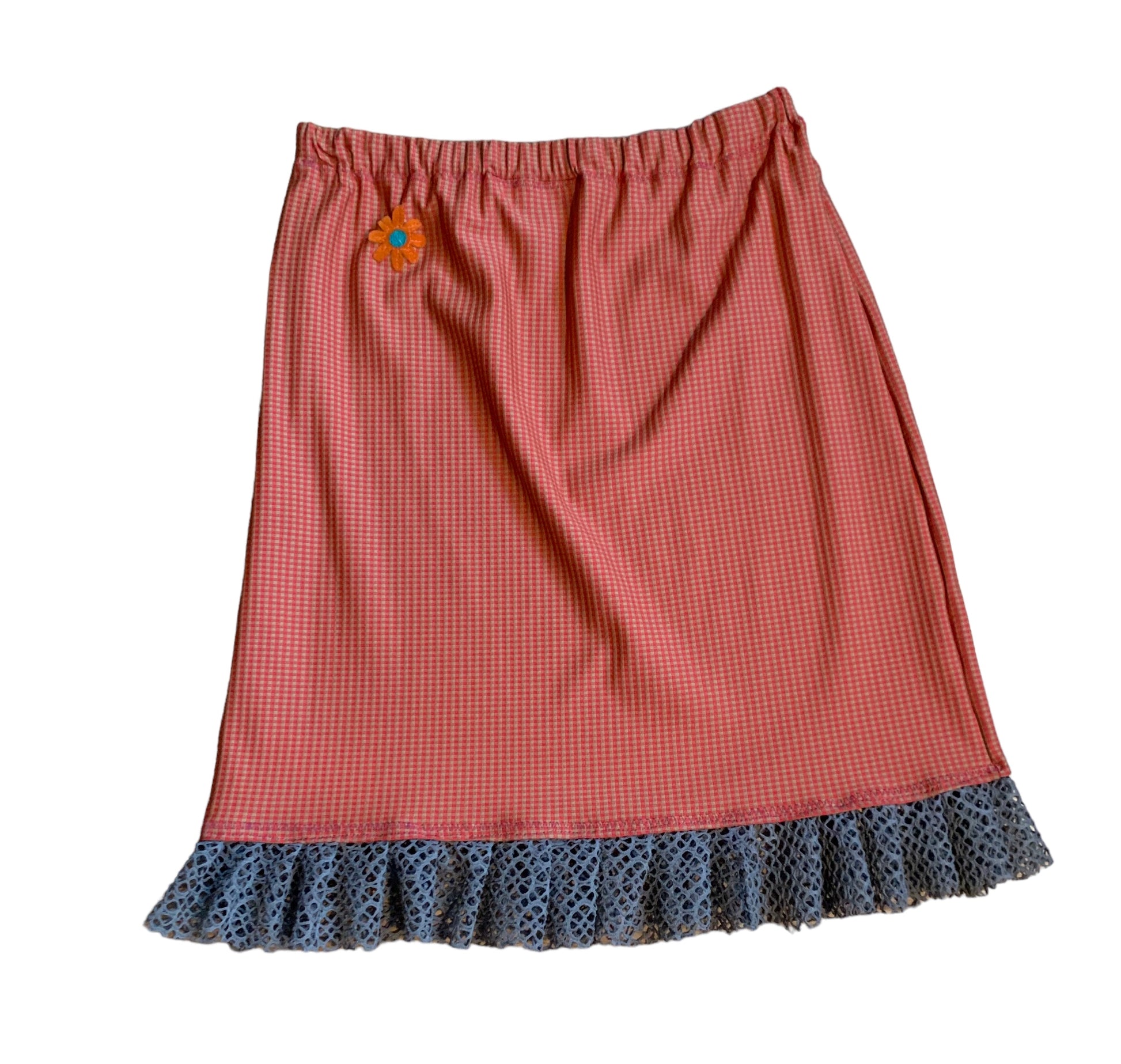 Orange/beige checked skirt with ruffles on botton and top with green bear in front 